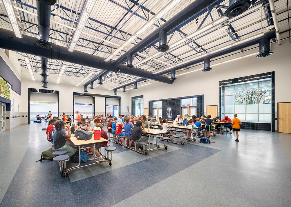 A large, modern school cafeteria.